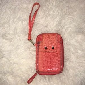 Wrist wallet and phone holder, used